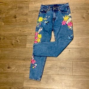 Embroidered flower mom jeans.
